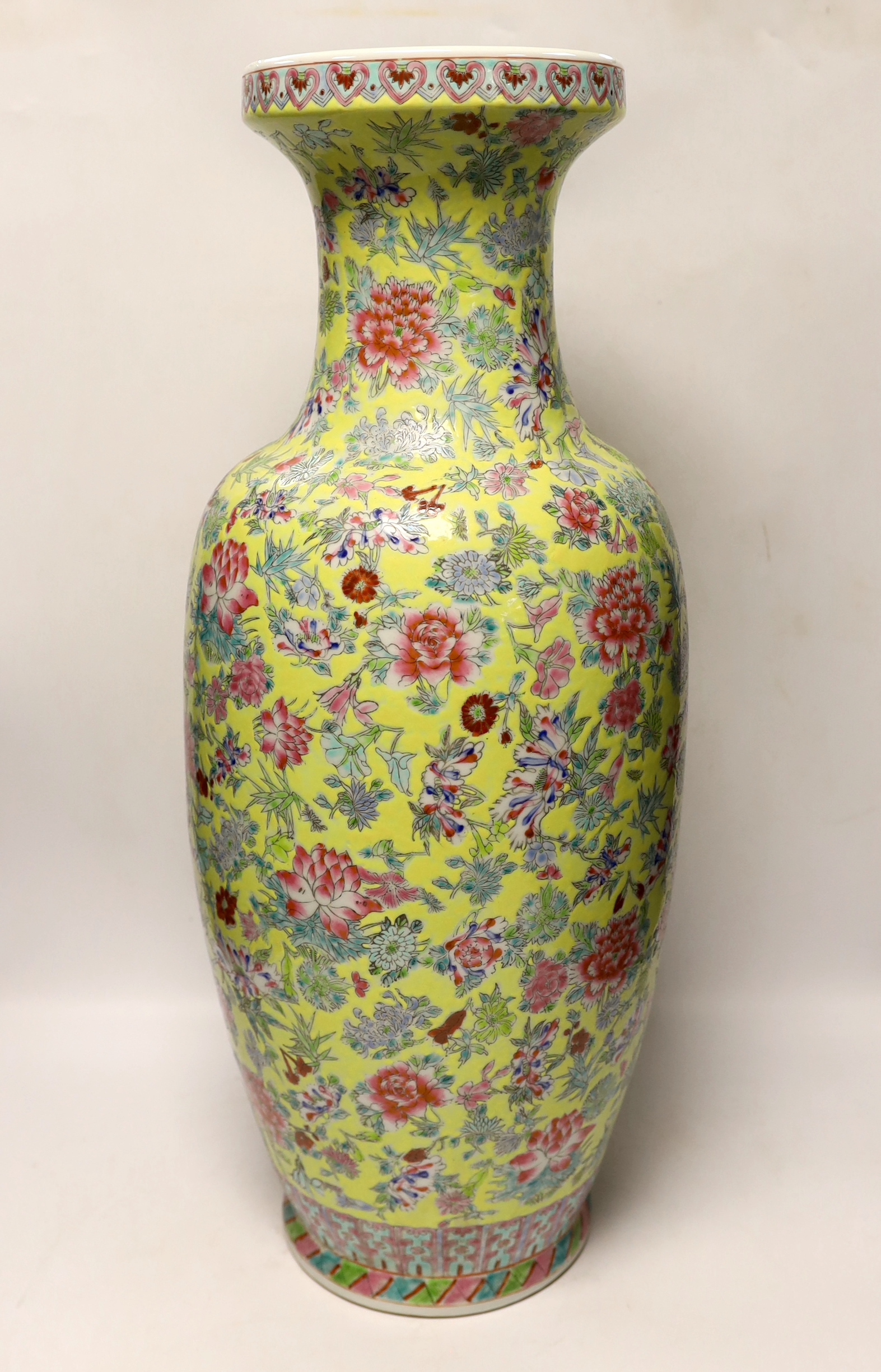 A large Chinese famille rose yellow ground baluster vase, 62cm high